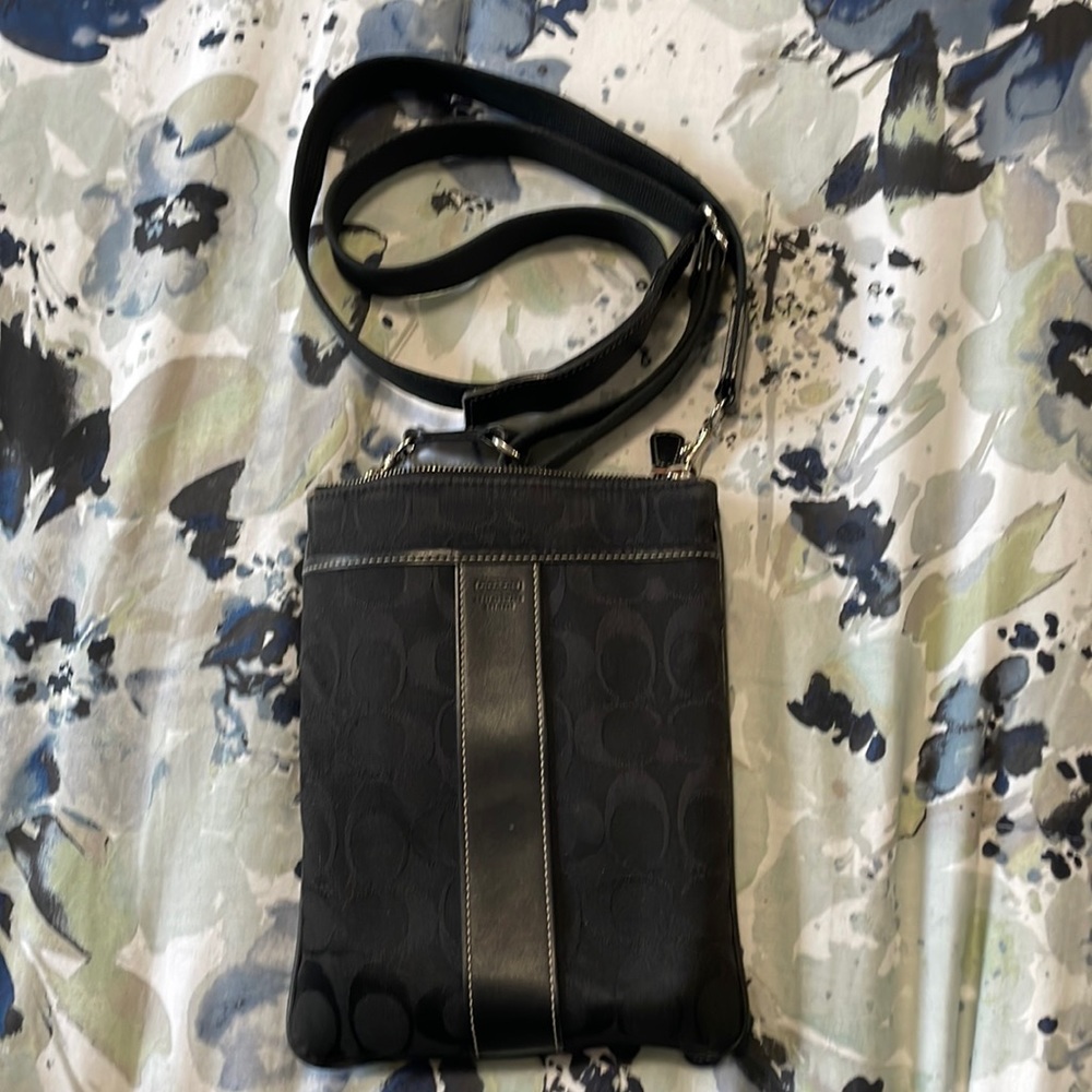 Black “C” patterned crossbody Coach bag